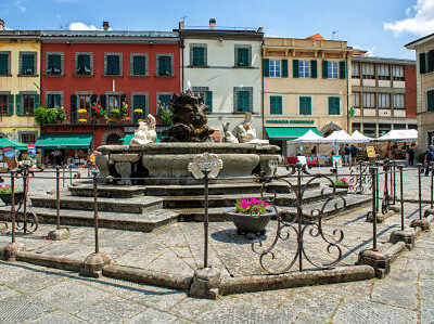 The small town of Fivizzano in Lunigiana. The main piazza, Piazza Vittorio Emanuele II, dominated by its fountain