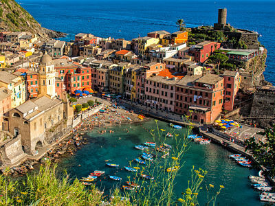 Panorama of Vernazza, with beach and parish church of Santa Margherita on the left and the tower of the Dorias on the right