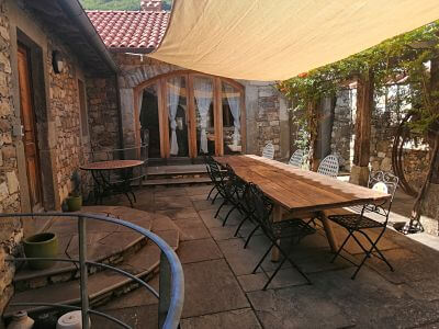Stone Courtyard with large table which easily seats eight people, perfect for BBQing