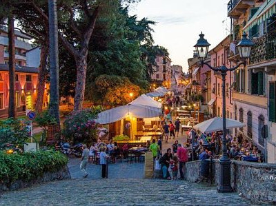 Early summer evening in Sarzana. The street is full of antique market stalls, ready for the attic in the streets festival